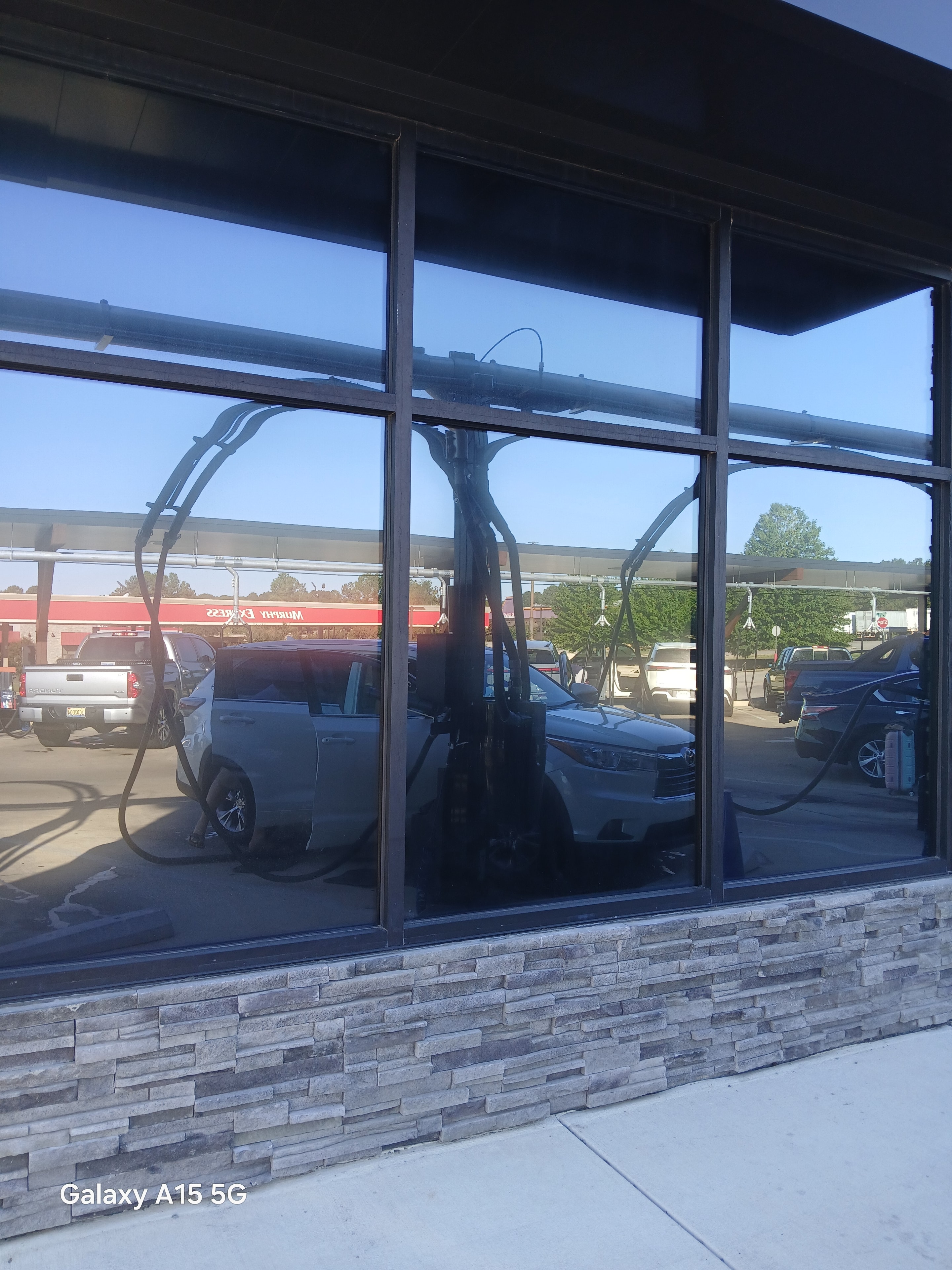 Retail storefront with clear glass and bright exterior glare